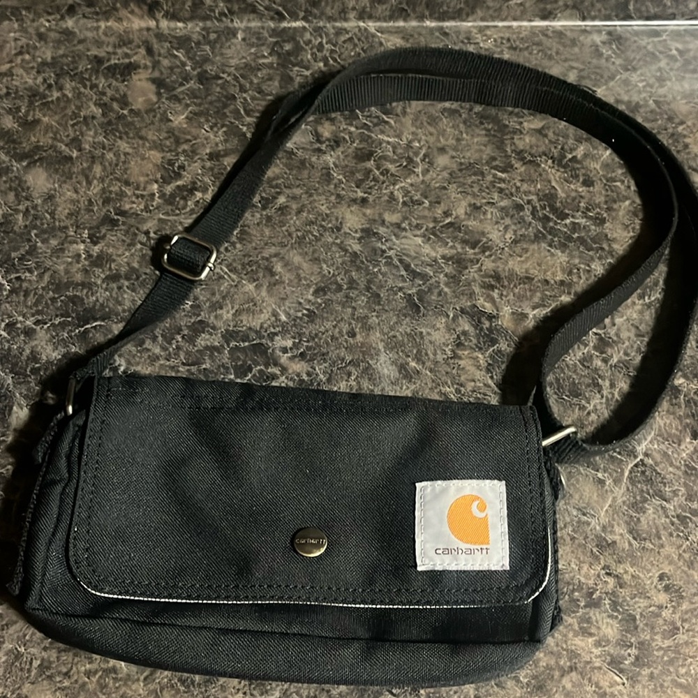 Small crossbody carhartt bag, can also be covert into belt bag. Used once
